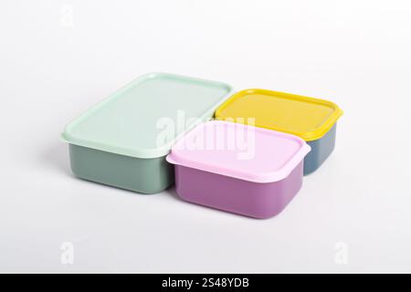 Three colorful Lunch Boxes isolated on white background. Plastic food containers Stock Photo