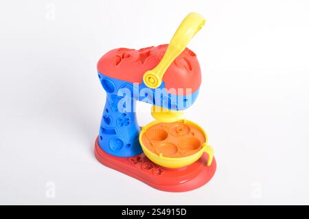 Children's toys, Cake factory isolated on white background. Cooking toys, Cake maker. Educational toys for children Stock Photo