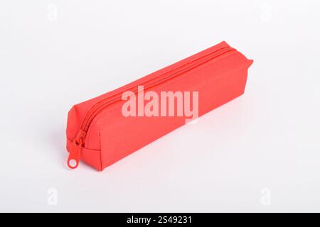 Red school pencil case isolated on white background. School stationery. Back to school. Copy space Stock Photo