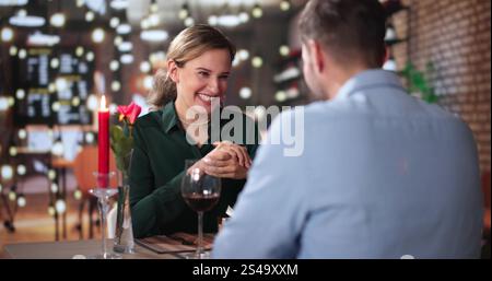 Romantic Couple Having Dinner At The Restaurant Stock Photo