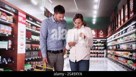 Confused Woman Checking Confused Receipt At Store Stock Photo