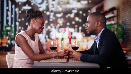Lovely Young Couple Having Romantic Dinner In Restaurant Stock Photo