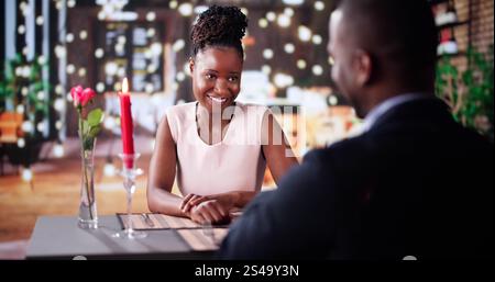 Romantic Couple Having Dinner At The Restaurant Stock Photo