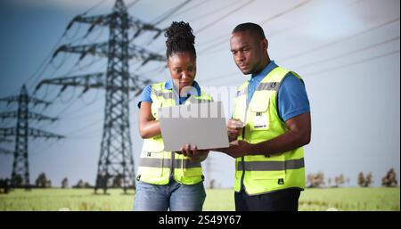 Engineers Using Computer Technology New Energy Tower. Electricity And Power Stock Photo