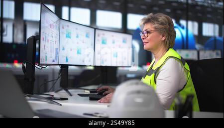Woman Working In Power Plant Electricity Generation Stock Photo