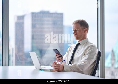 Busy professional business man executive working in big modern office. Stock Photo