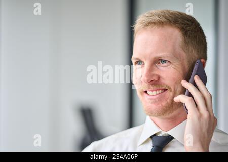 Busy professional business man making call talking on phone in office. Close up Stock Photo