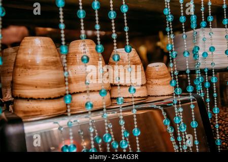 Small mugs for espresso lying on the coffee machine, a delicious aromatic drink in the coffee shop Stock Photo