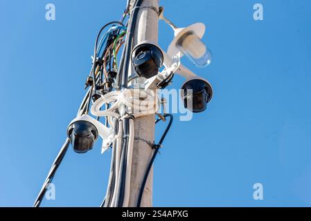 Many CCTV cameras are installed on the pole outside, safety and property protection Stock Photo