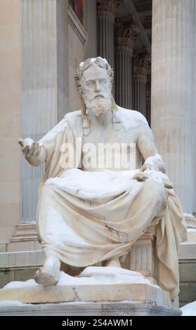 Vienna - The philosopher statue in front of Parliament building in winter - Xenophanes by Hugo Haerdtl (1846-1918) Stock Photo