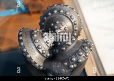 Drill bits. Perforator button for water wells. Tricone bit. Equipment for water and coal wells. Drilling tool Stock Photo