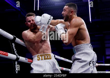 Callum Simpson (right) and Steed Woodall during the British, Commonwealth & WBA Continental Super Middleweight Championship contest at the Canon Medical Arena, Sheffield. Picture date: Saturday January 11, 2025. Stock Photo