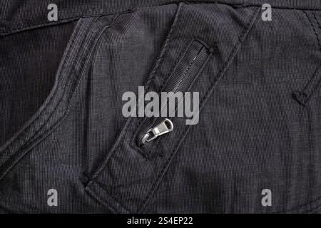 Black jeans texture with sewing pattern  and zipper, abstract close up Stock Photo