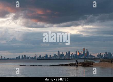 Sunset over Port Phillip Bay, looking towards the Melbourne CBD, seen from Green Point, Brighton. Victoria, Australia Stock Photo