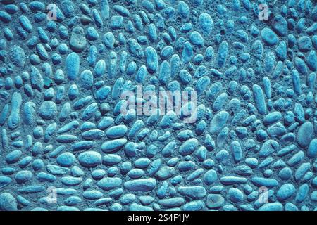 Abstract pebbles background. Blue pebbles texture. Stone background. Blue vintage color. Sea pebbles on concrete. Turquoise color Stock Photo
