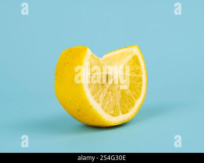 Lemon fruit, slice and half isolated on a light green background, fresh and juicy Lemon Stock Photo