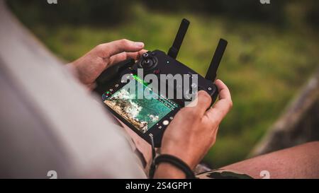 A man holding a remote drone controller Stock Photo