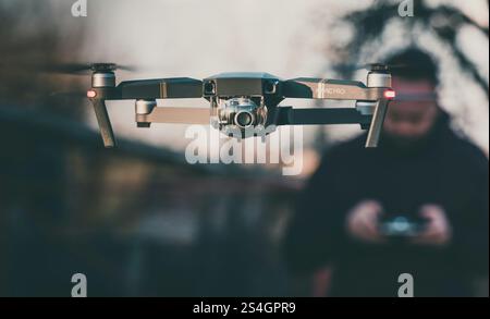 A man controlling a drone Stock Photo