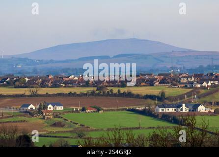 Moira Demesne, Moira, County Down, Northern Ireland, UK. 12 Jan 2025. UK weather - milder weather has arrived in Moira, with temperatures jumping up dramatically to a heady 6C. However it is still January and cold in the breeze. A bright morning looking across to Maghaberry and the hills closer to Belfast. Credit: CAZIMB/Alamy Live News. Stock Photo