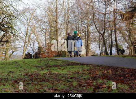 Moira Demesne, Moira, County Down, Northern Ireland, UK. 12 Jan 2025. UK weather - milder weather has arrived in Moira, with temperatures jumping up dramatically to a heady 6C. However it is still January and cold in the breeze. A family group with a dog out walking. Credit: CAZIMB/Alamy Live News. Stock Photo