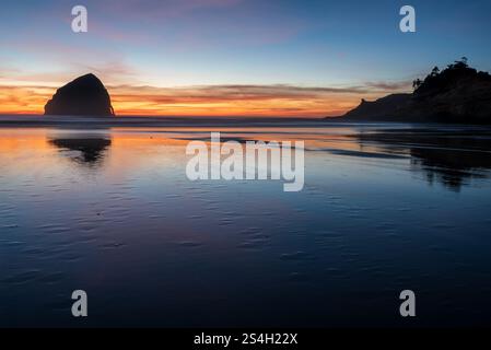 Kiwanda Beach, Cape Kiwanda and Haystack Rock at sunset, Oregon. Stock Photo