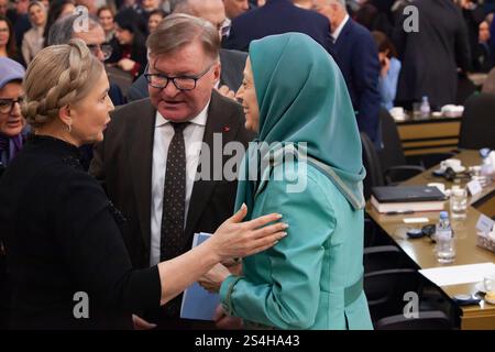 Auvers Sur Oise, France. 11th Jan, 2025. Yulia Tymoshenko, former Prime Minister of Ukraine and Maryam Rajavi, President-elect of the National Council of Resistance of Iran (NCRI) are seen chatting at the conference. In a gathering at the Trans-Atlantic conference held in Auvers-sur-Oise (north of Paris) titled New Policy toward the Iranian Regime. Standing with the Organized Resistance, former world leaders and military officials from Europe and the U.S. convened to discuss and propose a new strategic approach towards Iran. Credit: SOPA Images Limited/Alamy Live News Stock Photo