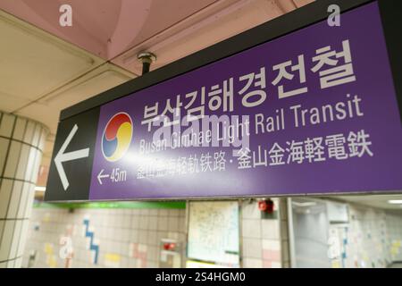 Busan, South Korea - May 29, 2017: close-up shot of the directional sign for Busan Gimhae Light Rail Transit, with an arrow indicating the direction. Stock Photo