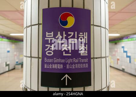 Busan, South Korea - May 29, 2017: close-up shot of the directional sign for Busan Gimhae Light Rail Transit, with an arrow indicating the direction. Stock Photo