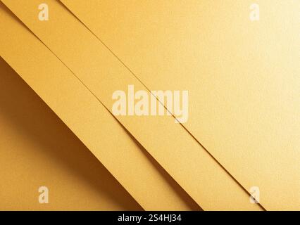 Golden yellow paper background with overlapping layers and a glossy, reflective surface. Warm honey gold tones and a grainy texture create a radiant, Stock Photo