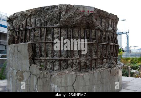 Damaged component of the former elevated freeway on the waterfront from the 1995 Great Hanshin Earthquake that ravaged the city of Kobe, Hyogo, Japan. Stock Photo