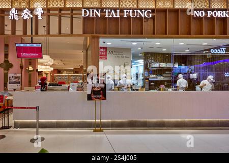 Din Tai Fung restaurant kitchen behind the glass pane at the Exchange TRX shopping mall in Kuala Lumpur, Malaysia. Stock Photo