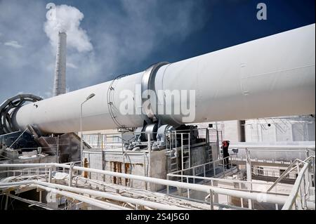 Tubular rotary furnace for lime processing and chimney Stock Photo