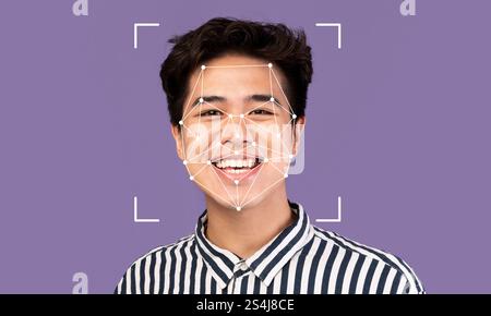 Facial recognition technology demonstrating identification on individual smiling Stock Photo
