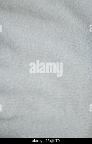 Close up of knitted white fabric, abstract textured background  Stock Photo