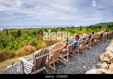 Rincon, Puerto Rico - March 4, 2018: Row of Adirondack chairs set up for watching sunsets. Stock Photo
