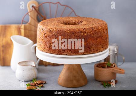 Pecan caramel pound cake baked in a bundt pan, homemade and served on a cake stand Stock Photo