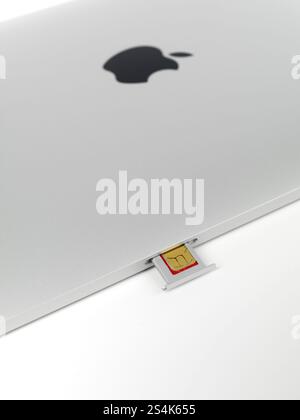 Apple iPad 3G tablet micro SIM card in a slot isolated on white background Stock Photo