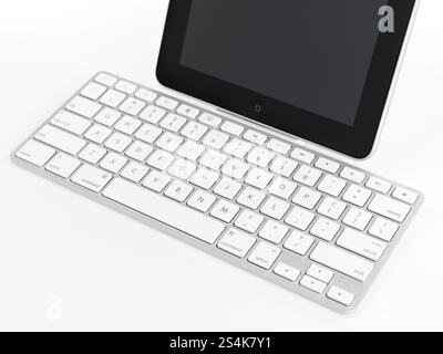 Apple iPad 3G tablet computer with a keyboard dock accessory isolated on white background Stock Photo