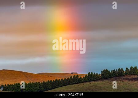 Sunset rainbow over the countryside at Blayney in the Central West of NSW, Australia. Stock Photo