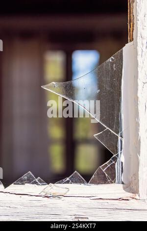 Broken glass shard in a window on a cottage Stock Photo