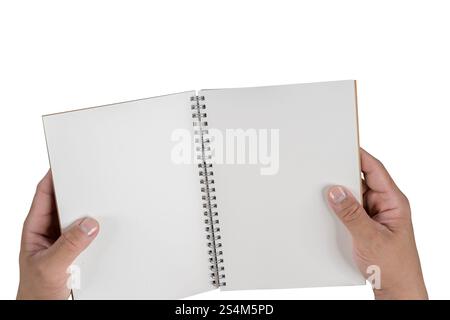 Hand holding a blank white hard cover book, cut out. Close up of two hands holding a blank paper, showcasing its empty pages. Isolated on transparent Stock Photo