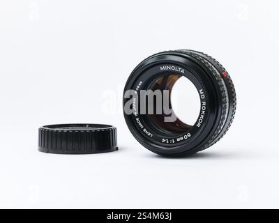 Minolta MD Rokkor 50mm 1:1.4 lens with rear cap isolated on white background Stock Photo