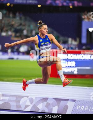 Maryna BEKH-ROMANCHUK participating in the Triple Jump at the Paris 2024 Olympic Games. Stock Photo