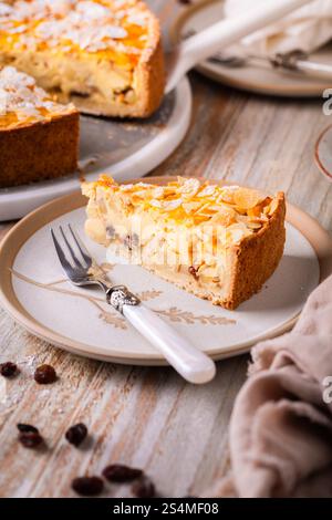 Homemade roasting apple cake with almonds and pudding filling with raisins Stock Photo