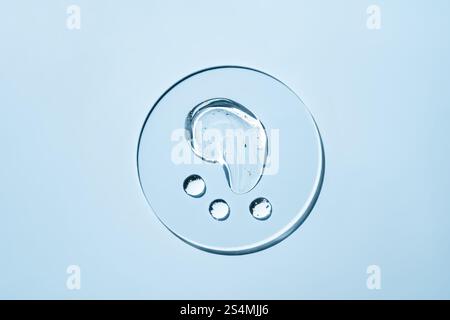 Transparent liquid droplets rest on a smooth, light surface The image showcases the purity and simplicity of the drops against the serene background, Stock Photo