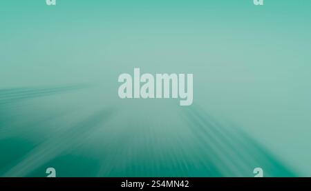 A serene 3D render of a radial blur converging towards the center, showcasing soothing tones of green that create a mesmerizing abstract background pe Stock Photo