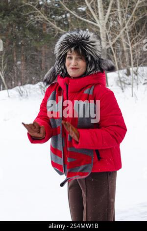portrait of a stylish woman 40 years old on a walk in a winter p Stock Photo