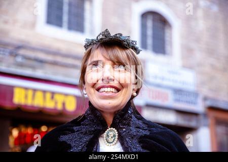 Mature caucasian woman smiling in vintage clothing outdoors Stock Photo