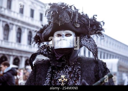 Elaborate masked costume at venetian carnival parade Stock Photo