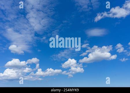 blue sky with cumulus clouds texture background Stock Photo